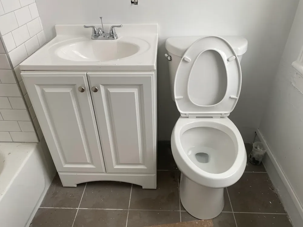 New bathroom vanity and toilet set on tile