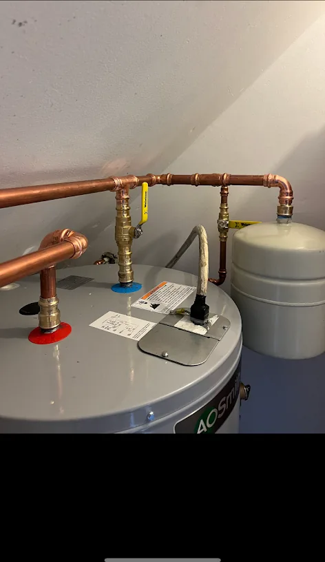 Water heater with new copper supply lines and an expansion tank